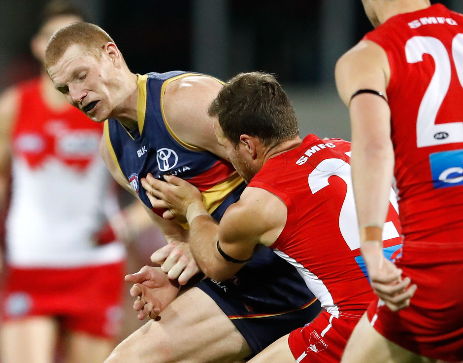 AFL 2016 First Semi Final - Sydney v Adelaide SYDNEY, AUSTRALIA - SEPTEMBER 17: Ben McGlynn of the Swans is bumped by Sam Jacobs of the Crows during the 2016 AFL First Semi Final match between the Sydney Swans and the Adelaide Crows at the Sydney Cricket Ground on September 17, 2016 in Sydney, Australia. (Photo by Adam Trafford/AFL Media)